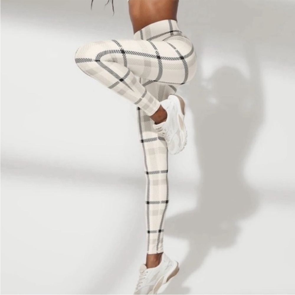 ALO Yoga Cream and Black Checkered Leggings